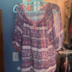 This is a super cute top with a slit in the sleeves.